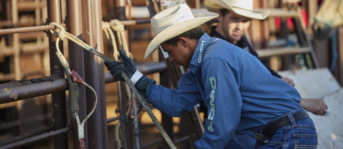 Laramie Mosley warming up the Rossin on his glove and bull rope before riding.